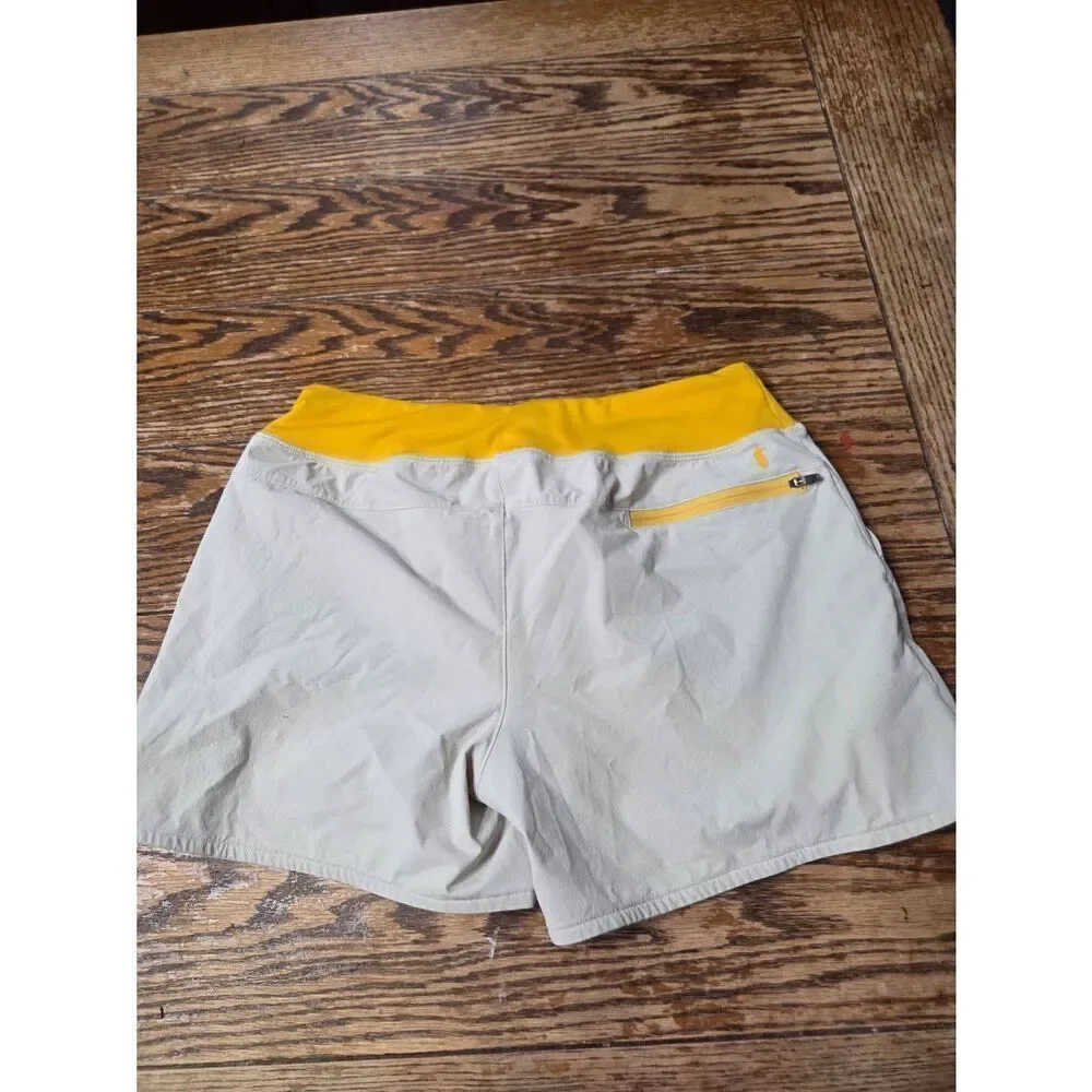 Cotopaxi Women's Vamos Hybrid Short in cream/yellow sz Small